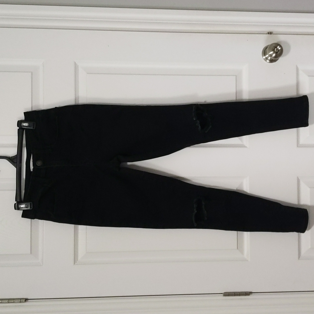 Black jean keggings with holes in the knee